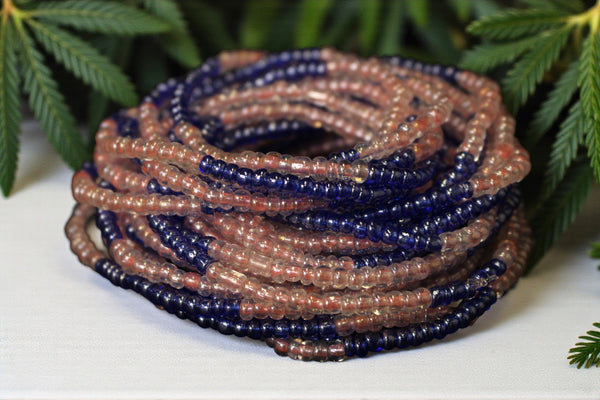 Waist Beads / Afrikaanse Heupketting - OSAYEMWENRE - Blauw / roze (elastisch)